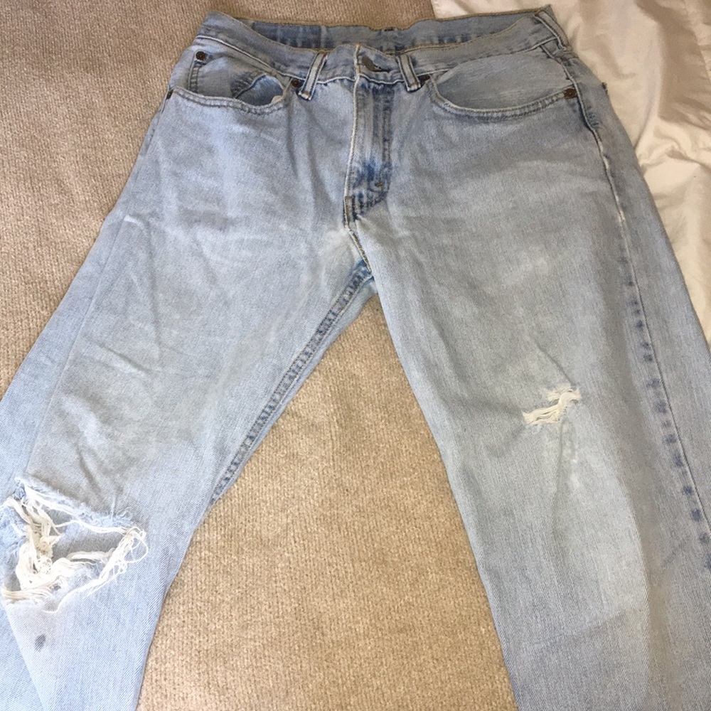 Faded worn blue jeans- 1980’s mom style